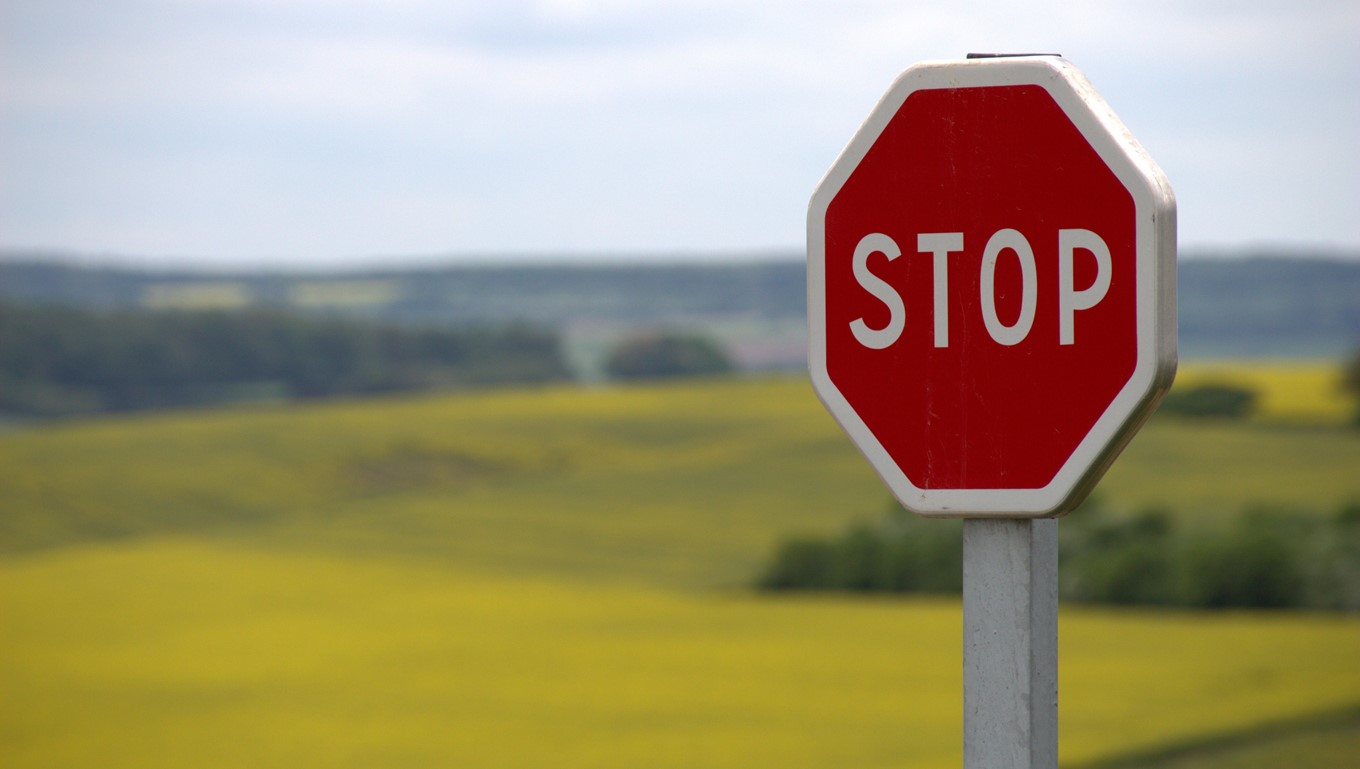 red stop sign in the countryside