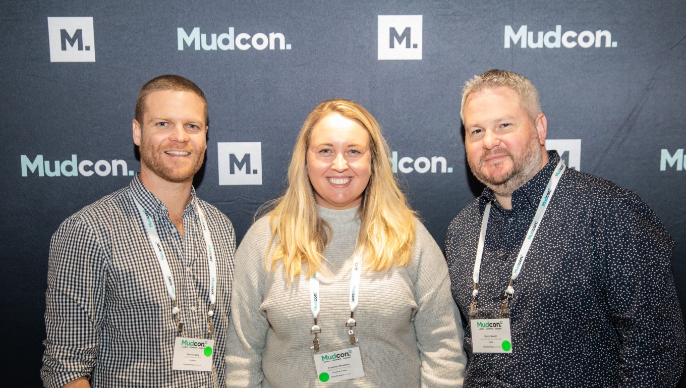 Smiling Mudbath executive team panel presenting at MudCon22