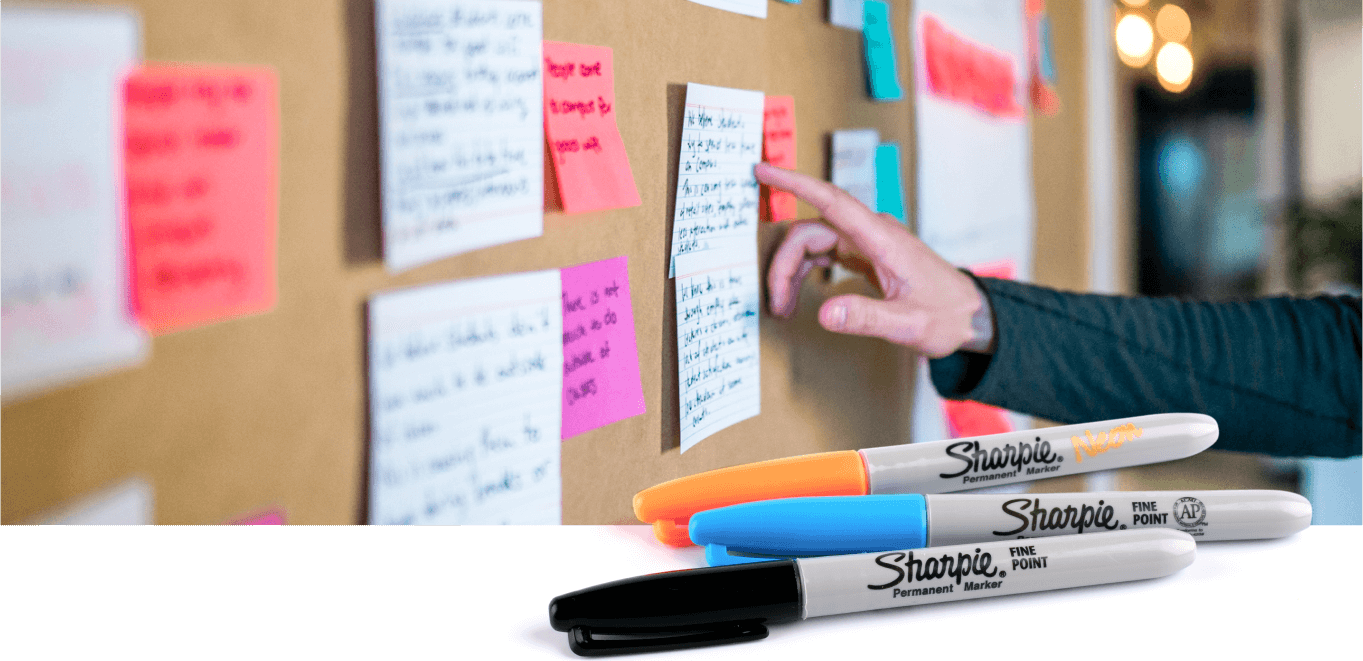 An image of post-it notes and sharpies